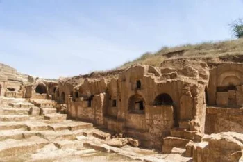 Mesopotamian ruins showing ancient dwellings carved in stone